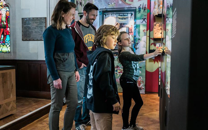 A family enjoying The Play's The Thing Exhibition at the Royal Shakespeare Company